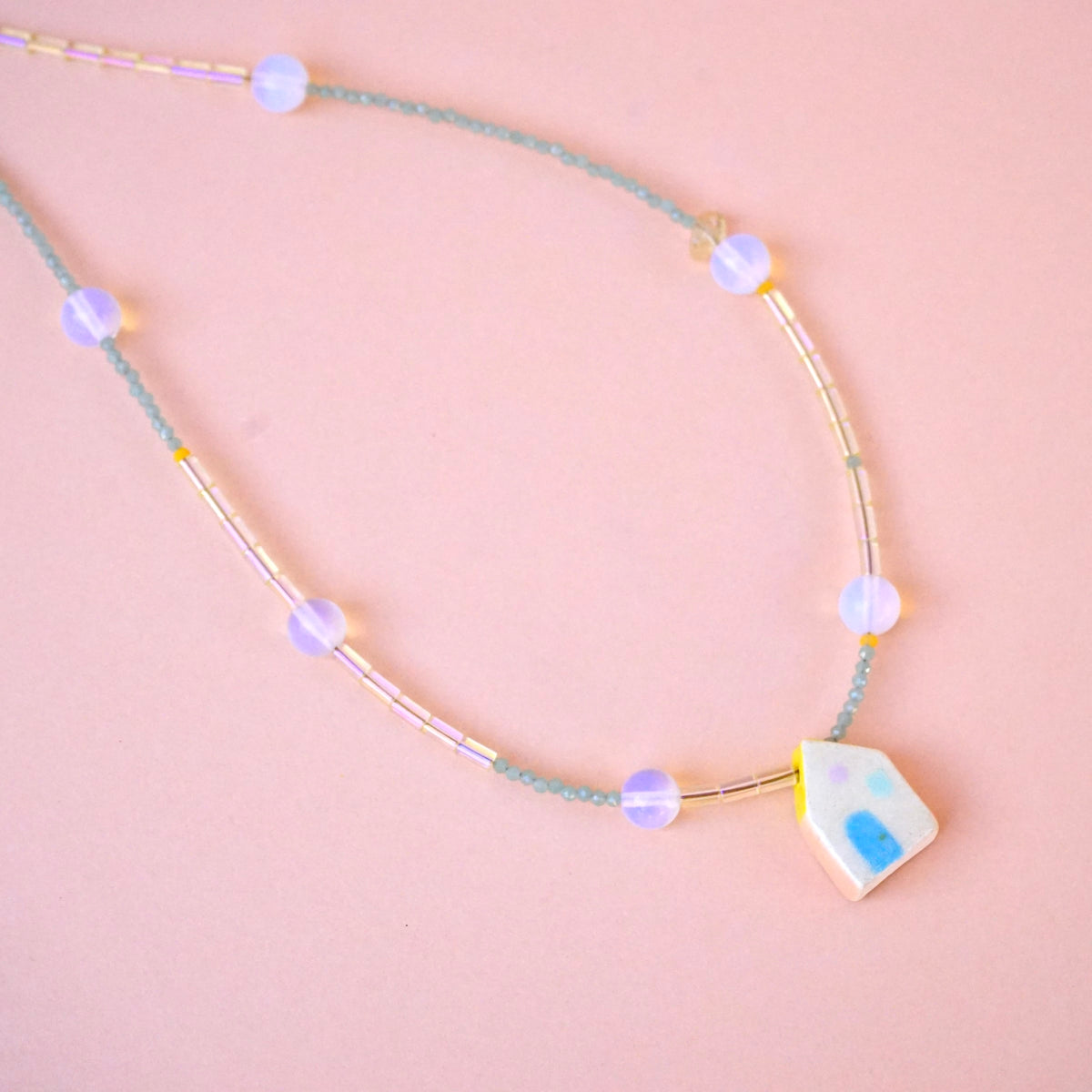 Collar casita tubo vidrio transparente piedra luna 01