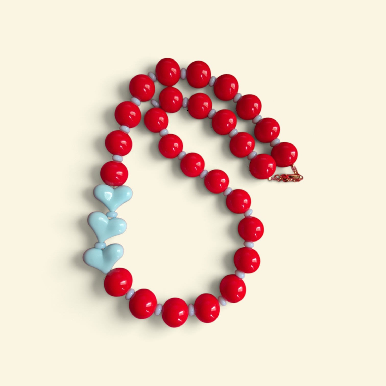 Collar Rojo/Celeste 3 corazones – DECATALOGO